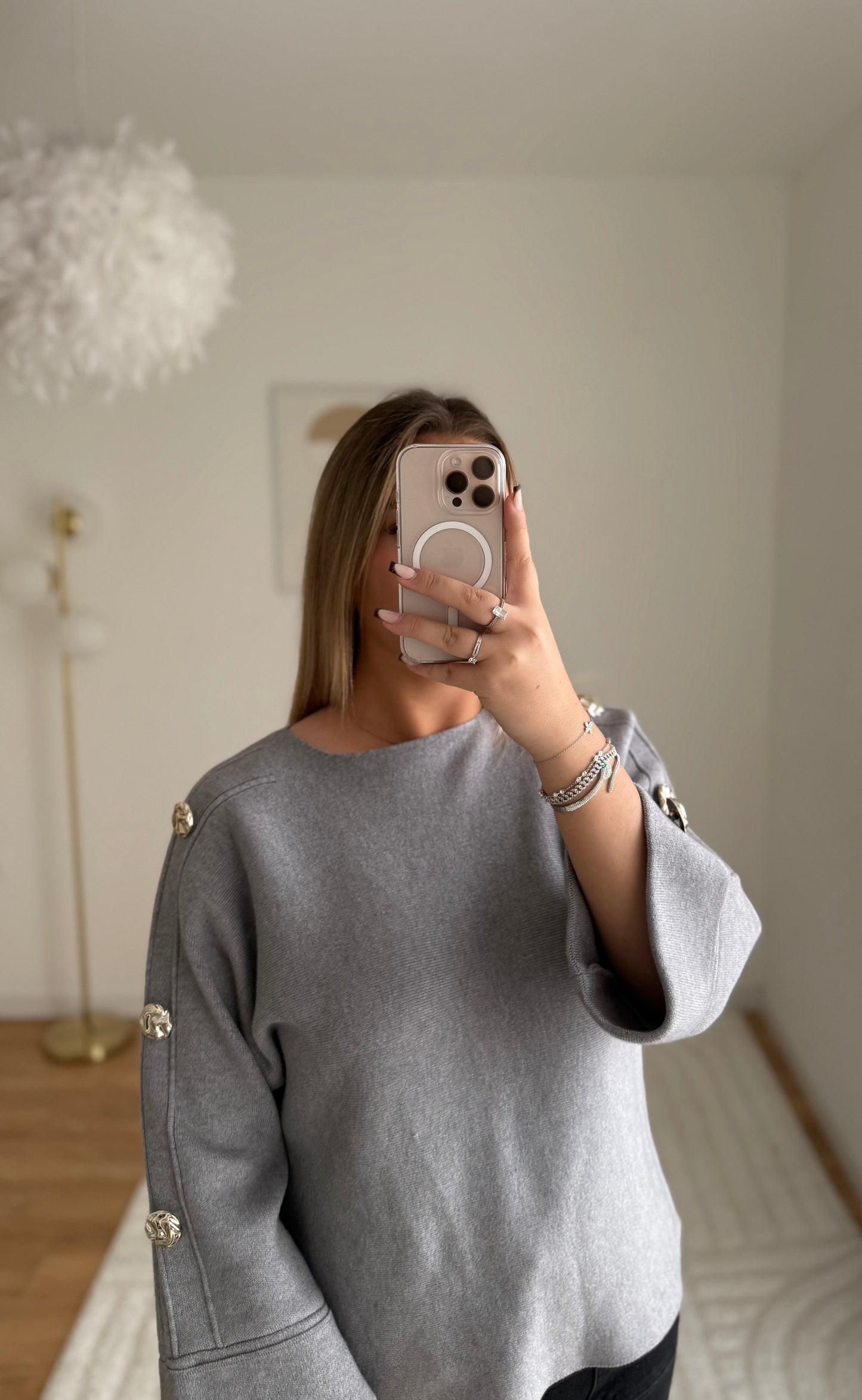 Pull gris manche bouton