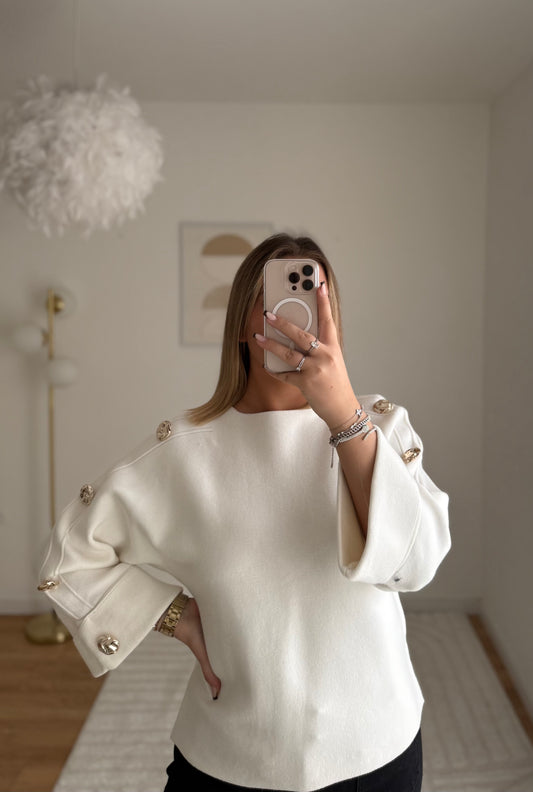 Pull blanc manche bouton